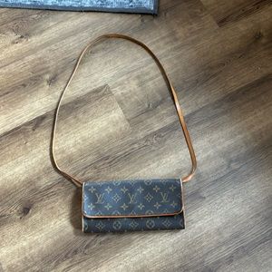 Louis Vuitton cross body wallet style. In great condition.